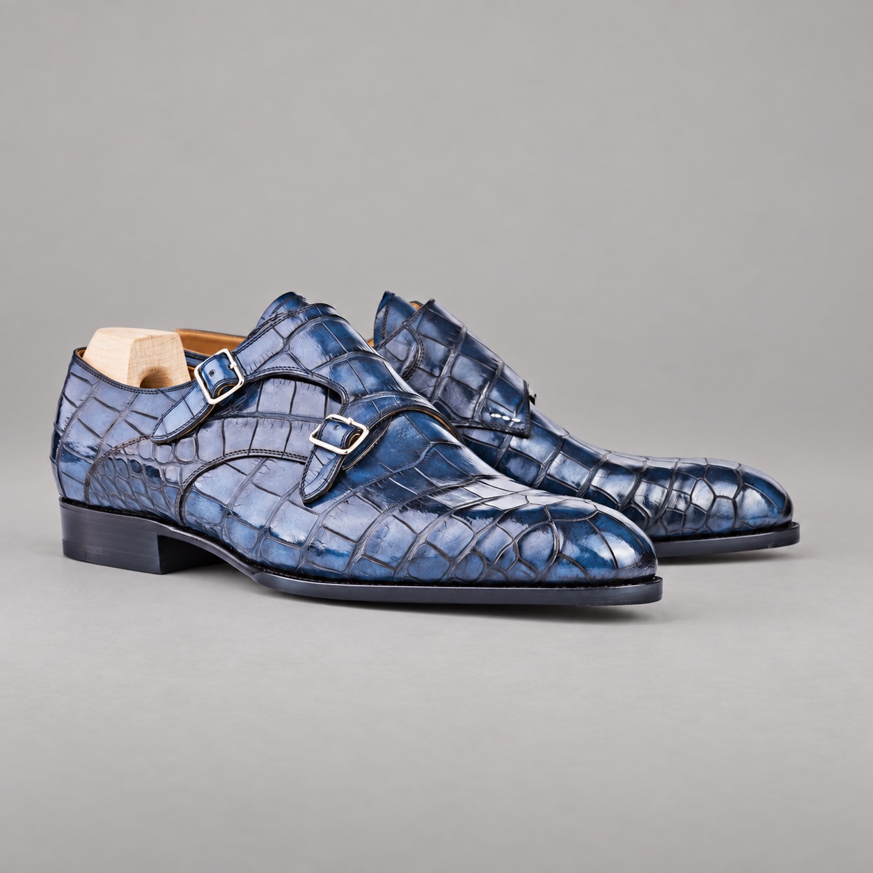 Three-quarter pair of blue alligator double monk strap dress shoes