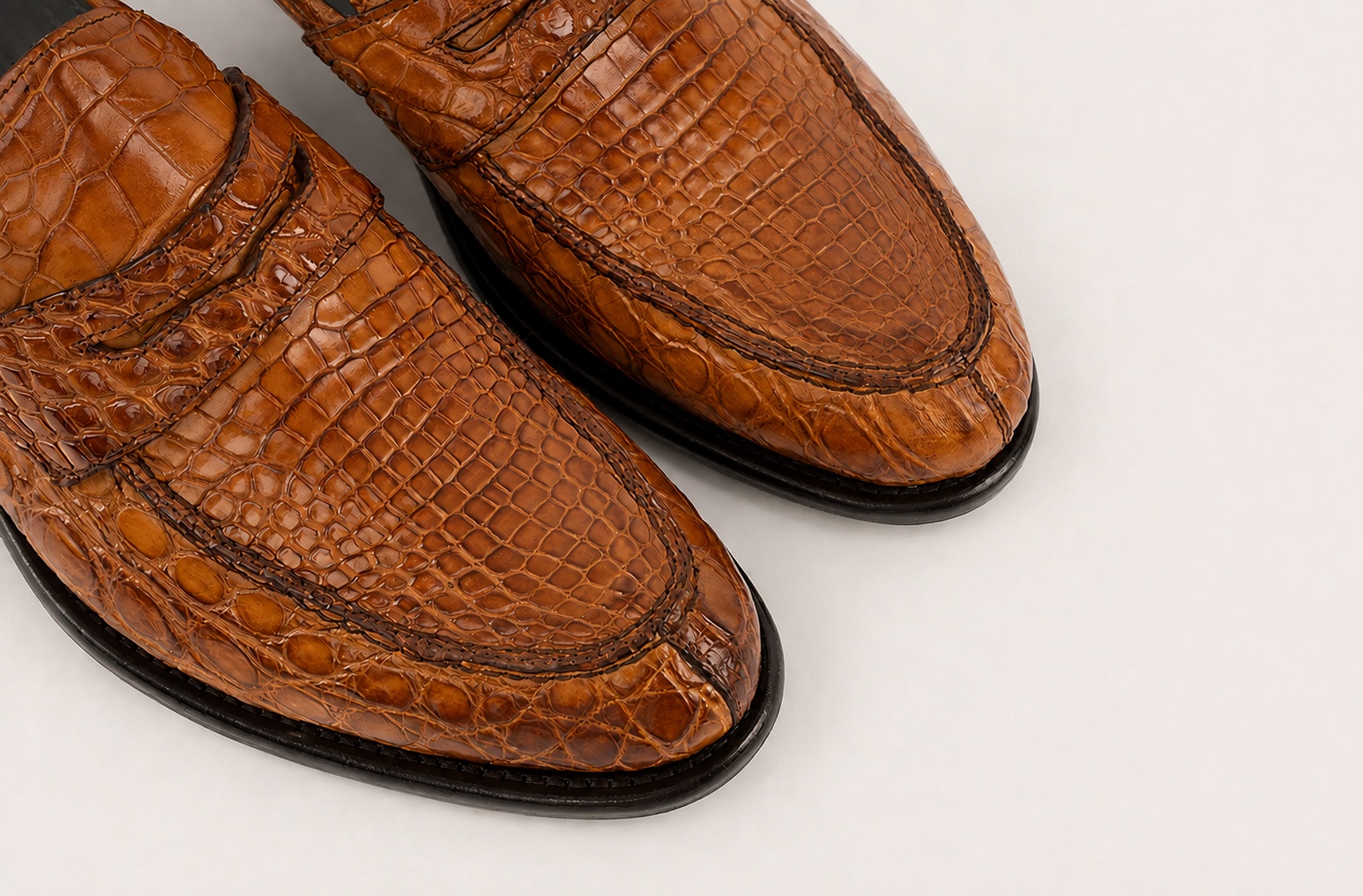 Close-up of the brick brown crocodile vamps and penny straps