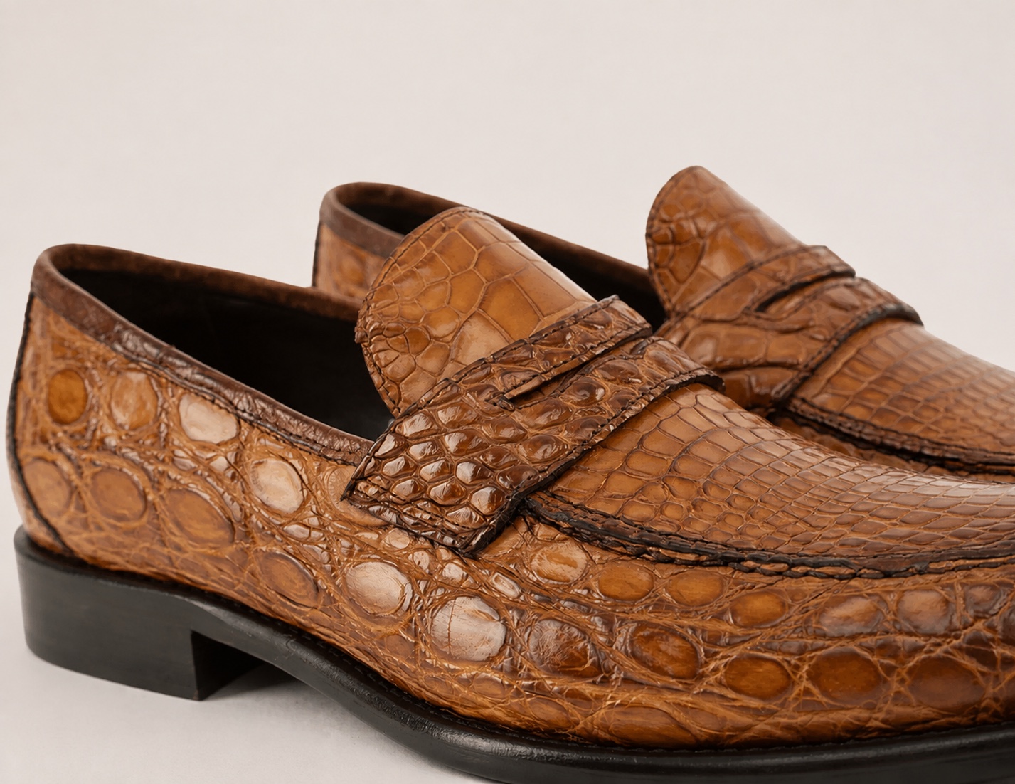 Brick brown crocodile penny strap, side-panel texture and dark lining detail