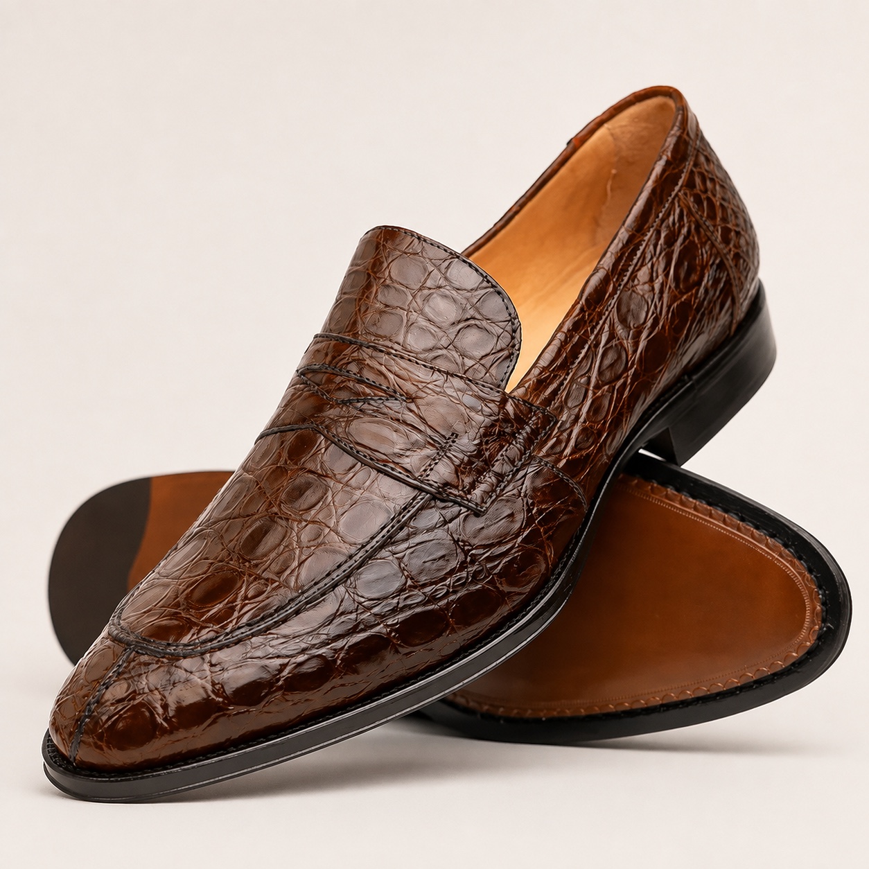 Cognac crocodile penny loafer angled view with sole visible