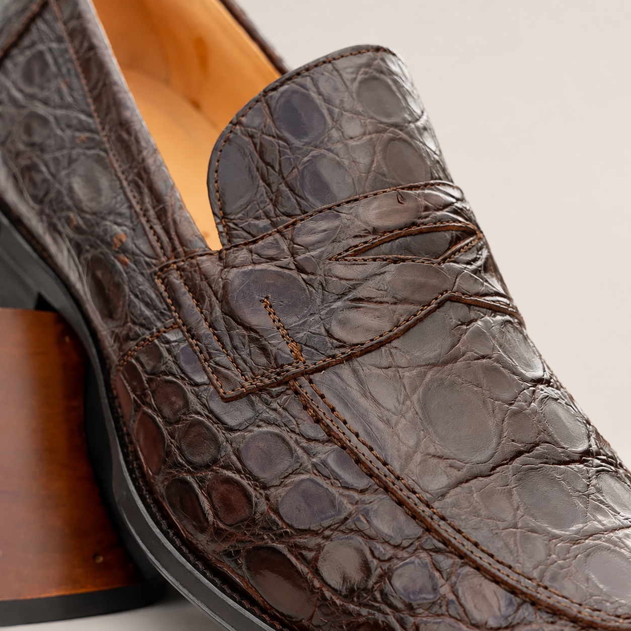 Close-up of the crocodile leather vamp and penny strap
