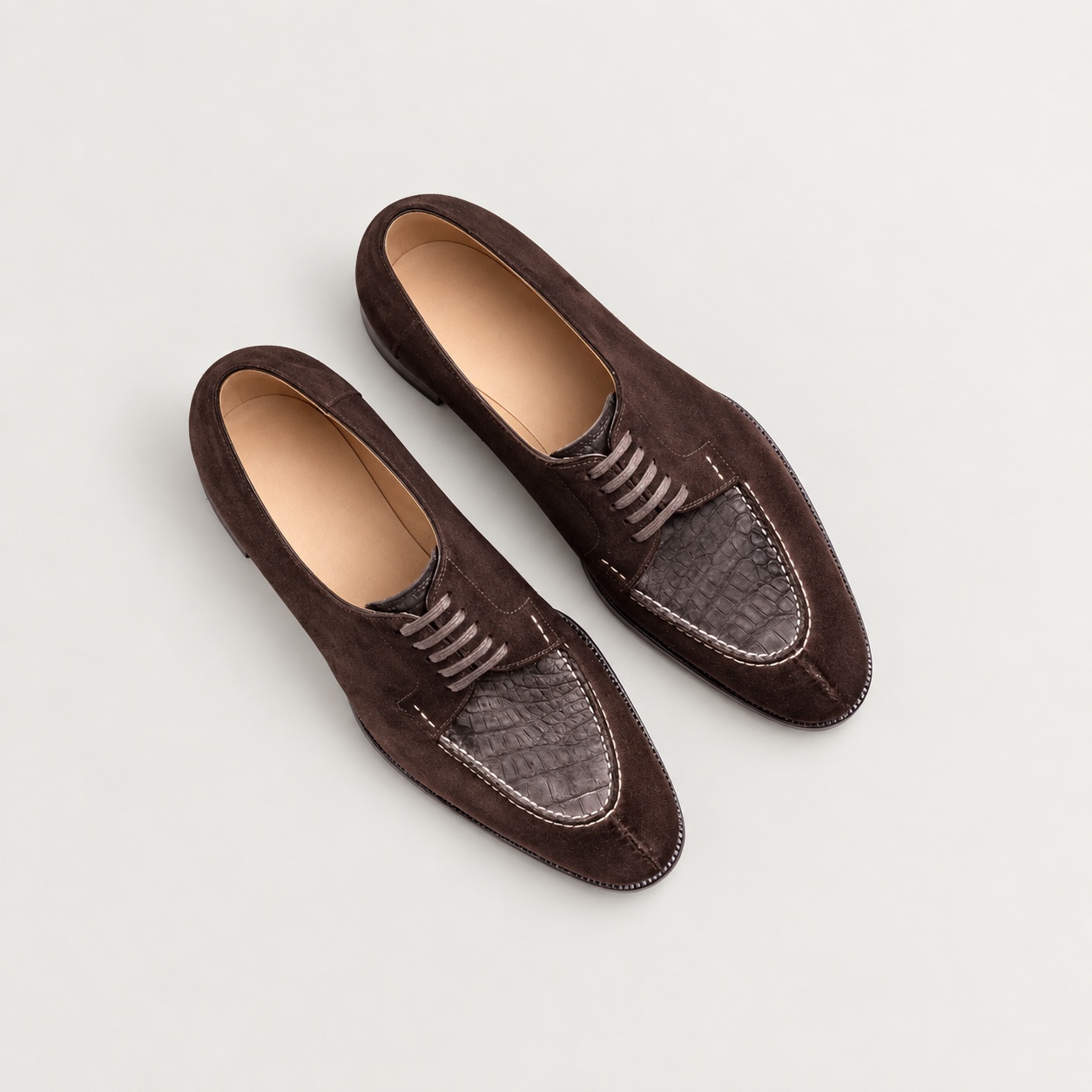 Overhead view of the alligator-panel shoes with digitally shown tan cowhide lining