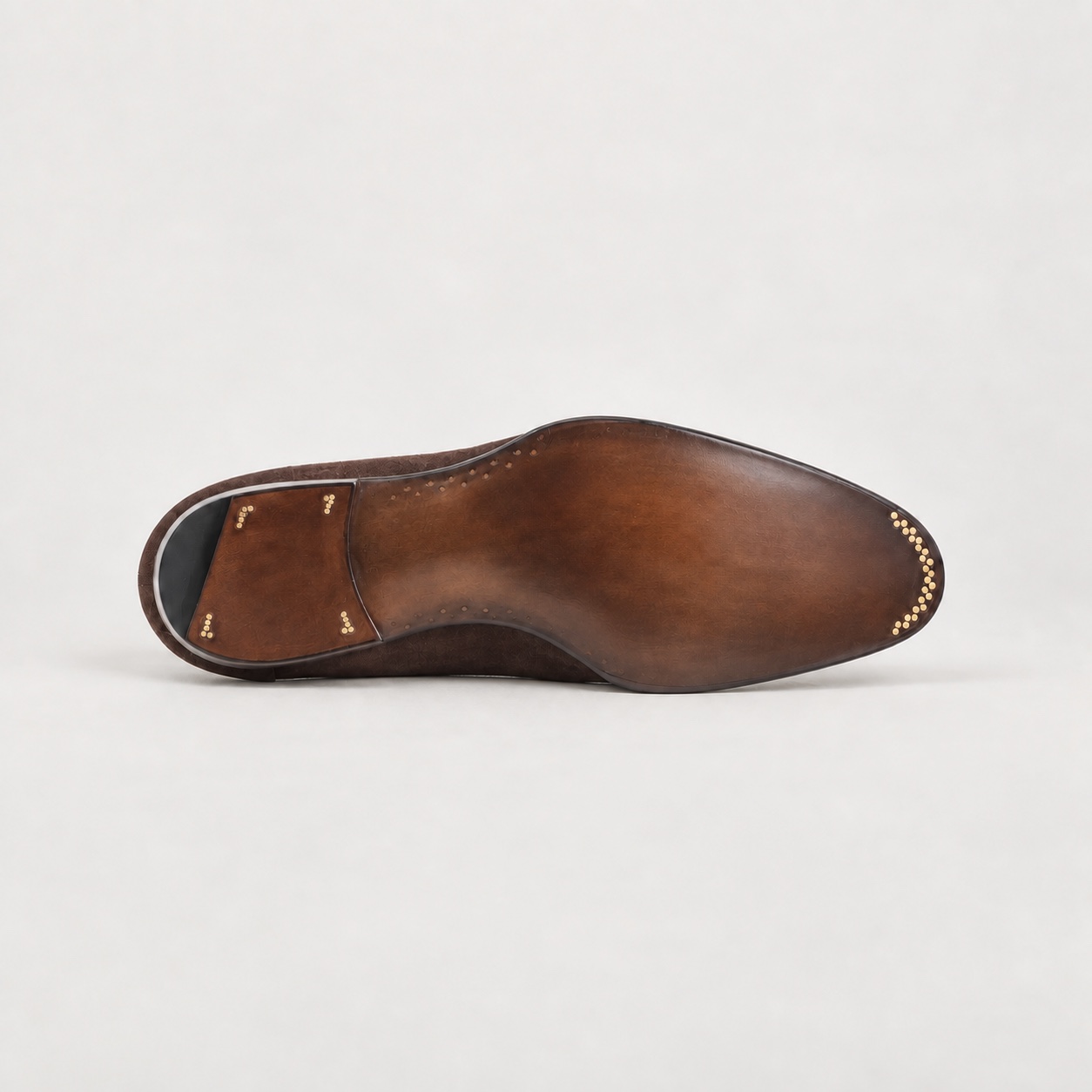 Digitally adjusted burnished brown outsole with identifying marks removed