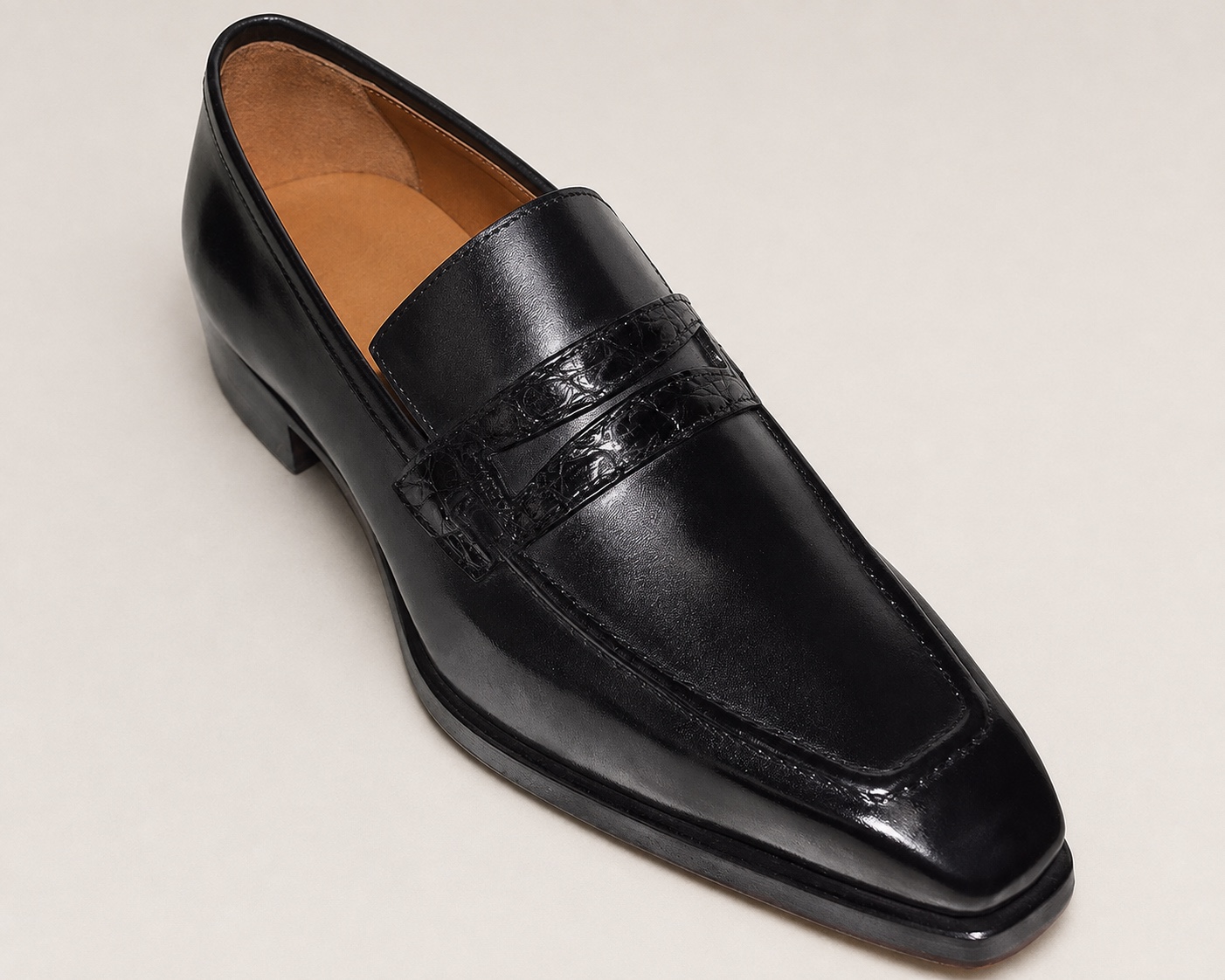 Black cowhide penny loafer with an alligator leather strap and digitally shown tan lining