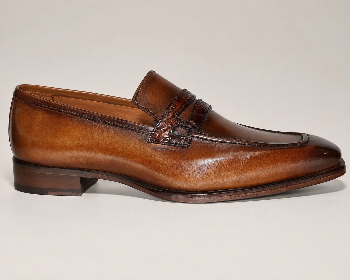 Side view of the brown hand-painted cowhide loafer with an alligator strap