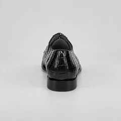 Rear view showing the black alligator heel seam and dark charcoal heel