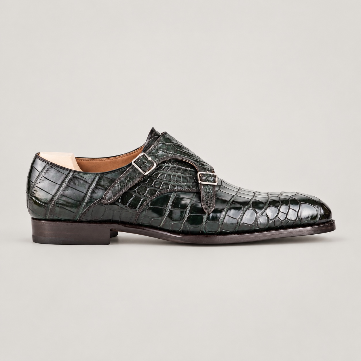 Olive alligator double monk strap shoe with silver-tone buckles, side view